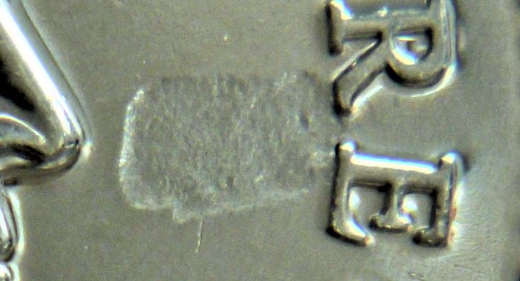 10 Cents 2016-Frappe a travers graisse coté avers-3.JPG
