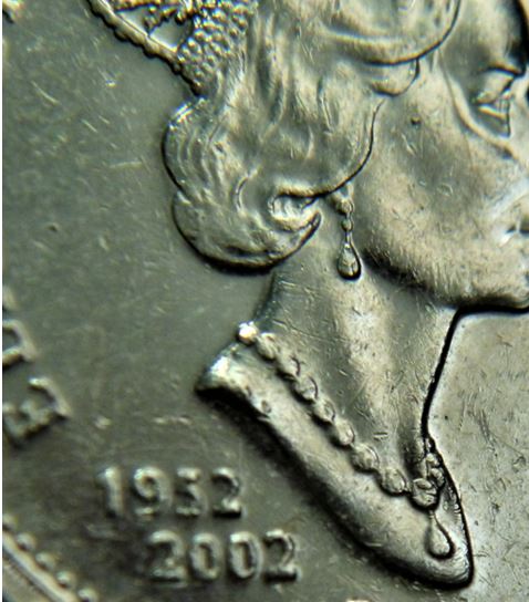 10 Cents 2002-Dommage du coin sur la temple de effigie-1.JPG