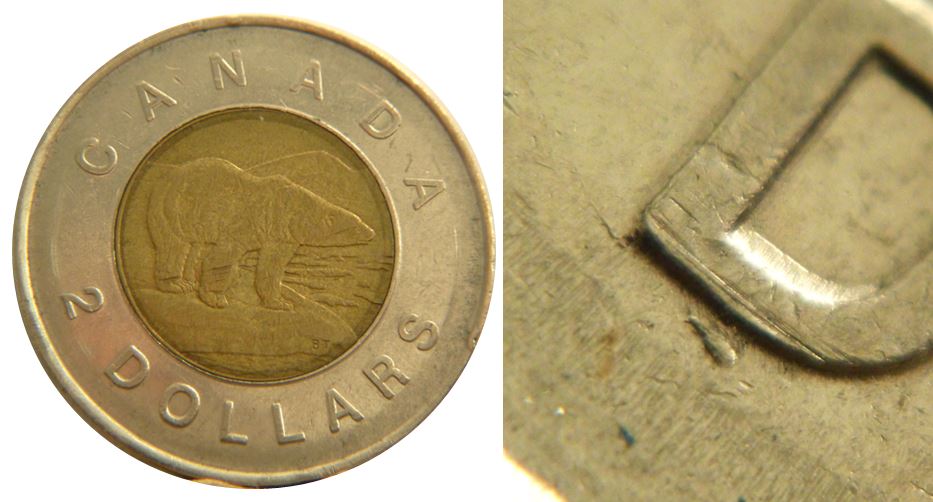 2 Dollars 1996-Éclat coin sous D de Dollar-2.JPG