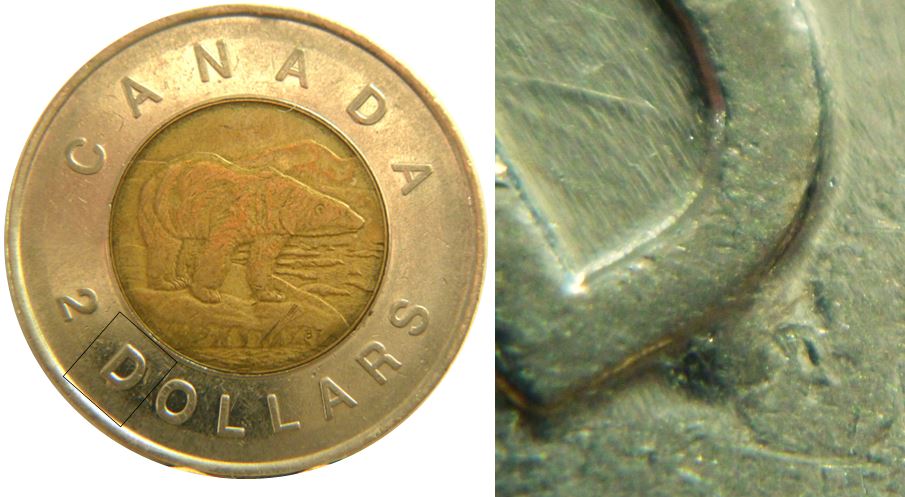 2 Dollars 1996-Éclat coin sous D de Dollars-No.3.JPG