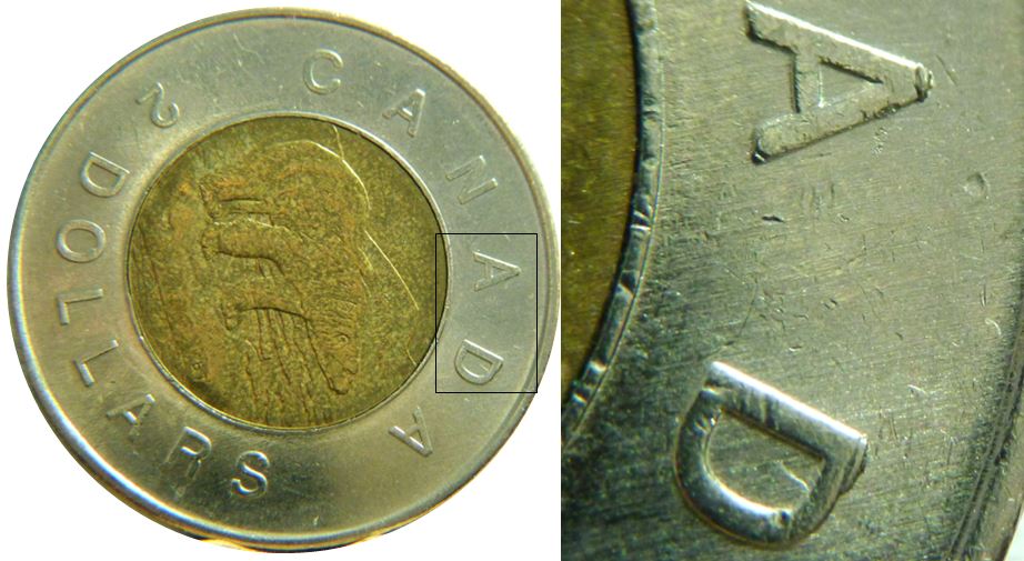 2 Dollars 2011-Éclat coin sur AD de canADa-1.JPG