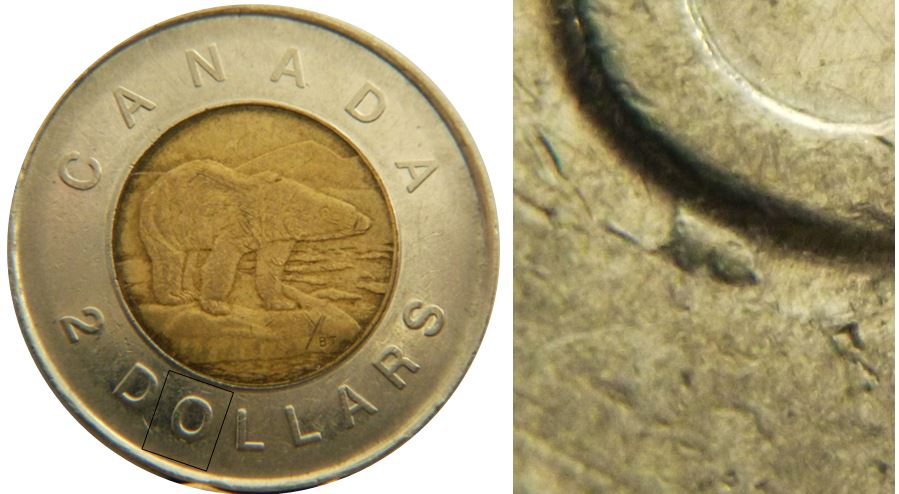 2 Dollars 1996-Éclat du coin sous O de dOllars-1.JPG