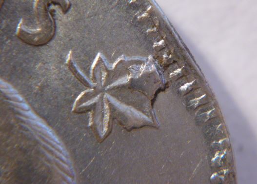 5 Cents 1952- Éclat de coin sur feuille droite-2.JPG