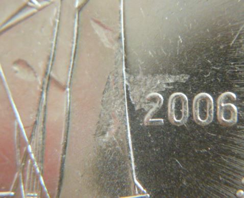10 Cents 2006-Frappe a travers graisse sur voilier.JPG