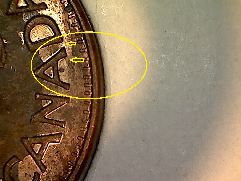 1973 Coin fendillé sous le 2e A de CANADA  B018065C.jpg