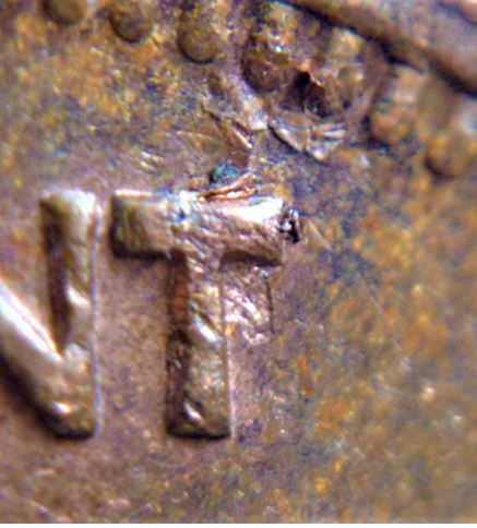 1 Cent 1975-Défaut de flan sous feuille droite Fragile-2.JPG