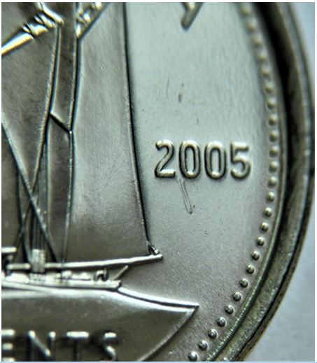 10 Cents 2005-Défaut du flan sous 20-1.JPG