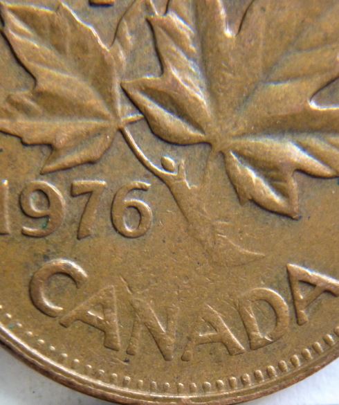 1 Cent 1976-Coin obturé coté revers-2.JPG