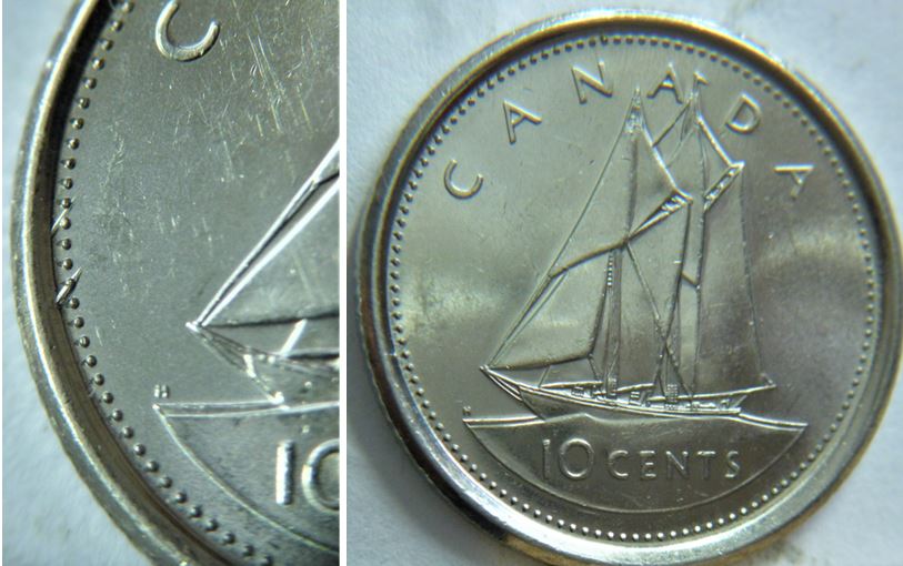 10 Cents 2002-Dommage du coin entre les perles devant le voilier-1.JPG