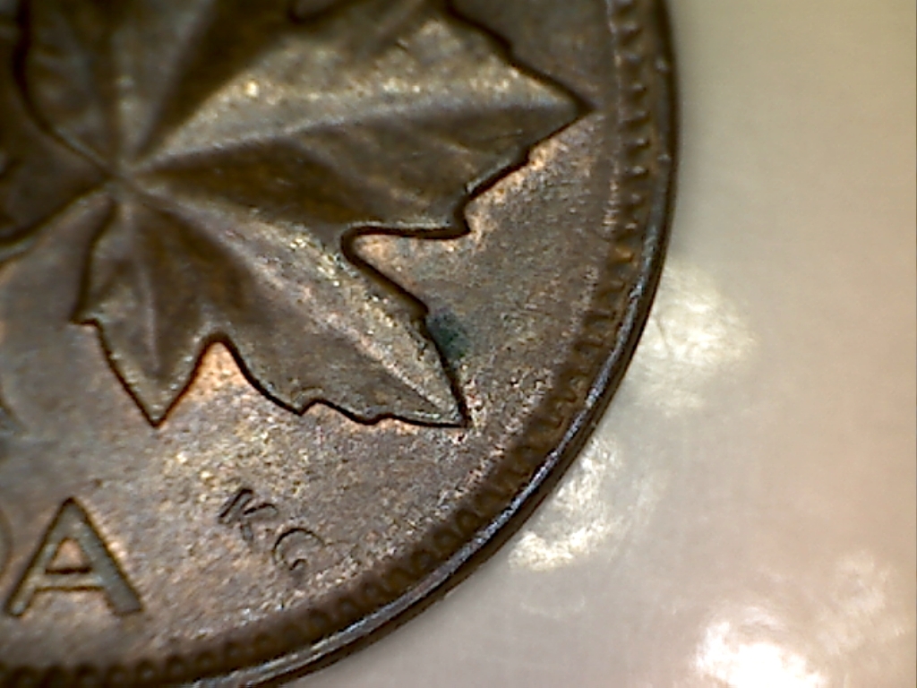 1964 Coin obturé au revers 12 à 15 hr. JD639.jpg