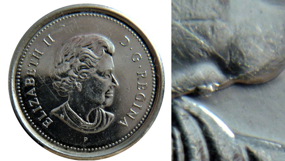 10 Cents 2004-Éclat coin sous menton+Entrechoqué sur le voilier-1.JPG