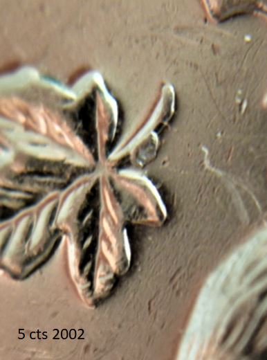 5 Cents 2002-Éclat coin a la tige de la feuille gauche-,2.JPG