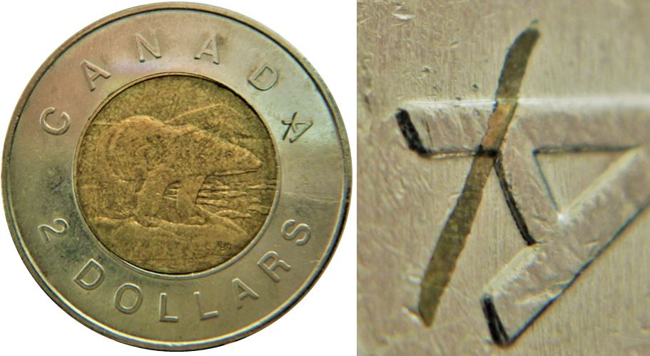 2 Dollars 2010-Résidu de métal encastré sur A de canadA-2.JPG