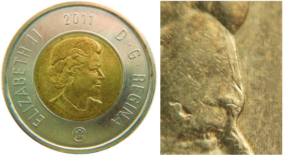 2 Dollars 2011 MRC-Dépôt de métal sur tout le front-1.JPG