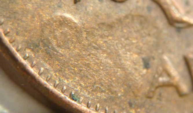 1 Cent 1973-Coin obturé sur Cana-2.JPG