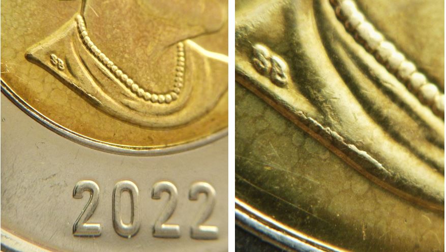 2 Dollars 2022-Coin fendillé devant signature-1.JPG