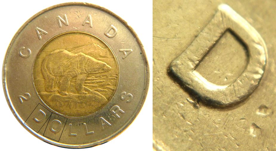 2 Dollars 1996-Éclat coin sous DO de DOllars-1.JPG