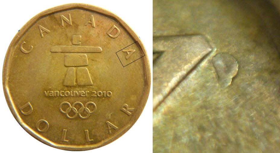 1 Dollar 2010-Défaut flan près A de canadA-1,.JPG
