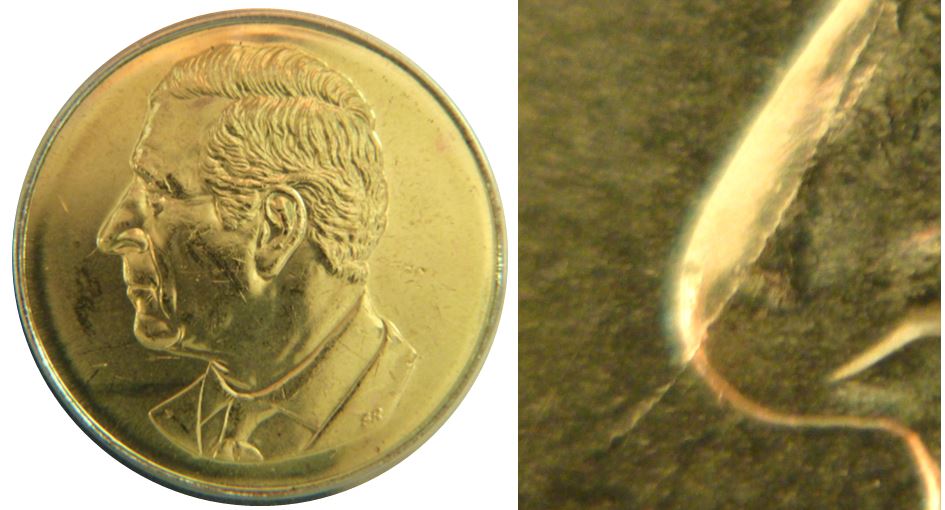2 Dollars 2025-Coin fendillé sur nez de effigie-1.JPG