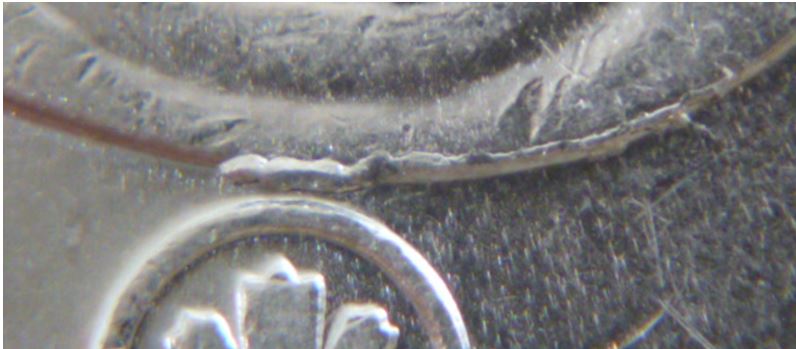 5 Cents 2009-Éclat de coin près du logo-1.JPG